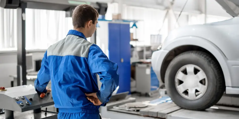 Mechanic performing an MOT test